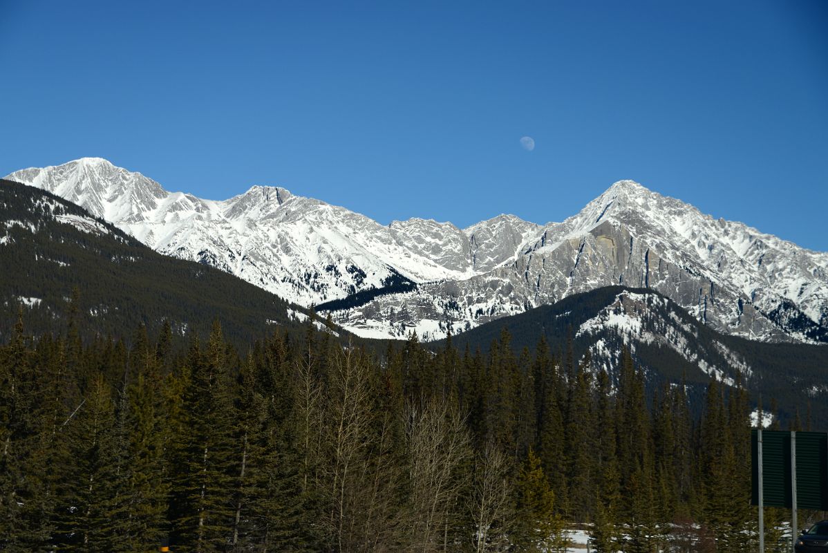 29A Mystic Peak And Mount Ishbel With Moon Afternoon From Trans Canada Highway Driving Between Banff And Lake Louise in Winter
